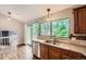The Kitchen features granite countertops, stainless steel appliances, and a large window with natural light at 18984 E Kent Cir, Aurora, CO 80013