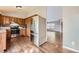 View of kitchen with a stainless-steel refrigerator and wooden cabinets at 18984 E Kent Cir, Aurora, CO 80013