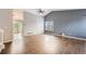Bright living room with high ceiling, wood floors, big windows and access to the deck at 18984 E Kent Cir, Aurora, CO 80013