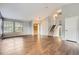 Bright living room with wood floors, large windows and a staircase leading to the upper level at 18984 E Kent Cir, Aurora, CO 80013