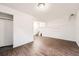 Spacious living room features wood-look floors, white walls, and stairs at 18984 E Kent Cir, Aurora, CO 80013