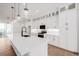 Gourmet kitchen with stainless steel appliances, stylish lighting, and expansive island at 2361 Junegrass Ln, Superior, CO 80027