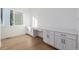 Bright office space featuring hardwood floors, and modern built-in cabinets for ample storage at 2361 Junegrass Ln, Superior, CO 80027