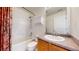 Clean bathroom with shower, vanity and cabinet storage space with stylish shower curtain at 6898 W Rockland Pl, Littleton, CO 80128