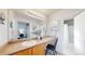 Well-lit bathroom with a large countertop, vanity and shower with tub at 6898 W Rockland Pl, Littleton, CO 80128