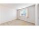 This room features neutral walls and carpet with a window for natural light at 6898 W Rockland Pl, Littleton, CO 80128