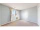This bedroom has neutral paint and carpet, with a window for natural light at 6898 W Rockland Pl, Littleton, CO 80128