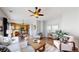 Open concept living room features hardwood floors and comfortable seating at 6898 W Rockland Pl, Littleton, CO 80128