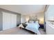 Comfortable bedroom with plush carpet and plenty of closet space at 6898 W Rockland Pl, Littleton, CO 80128