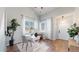 Bright office space with hardwood floors, natural light, and a modern white desk and décor at 6898 W Rockland Pl, Littleton, CO 80128