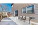 Back patio with furniture perfect for outdoor entertaining, next to the house at 6898 W Rockland Pl, Littleton, CO 80128
