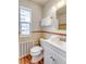 Updated bathroom with a modern vanity, toilet, and decorative tile at 1100 Colorado Blvd # 305, Denver, CO 80206