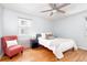 Comfortable bedroom with hardwood floors, a ceiling fan, and plenty of natural light at 1100 Colorado Blvd # 305, Denver, CO 80206