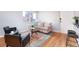 Cozy living room with stylish furniture, hardwood floors, and natural light at 1100 Colorado Blvd # 305, Denver, CO 80206