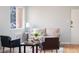 Bright living area features hardwood floors, a plush sofa, and great natural light at 1100 Colorado Blvd # 305, Denver, CO 80206