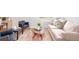 Living area features light gray walls and a decorative rug at 1100 Colorado Blvd # 305, Denver, CO 80206