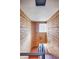 Unique stairwell featuring brick walls, patterned tile, and natural light at 1100 Colorado Blvd # 305, Denver, CO 80206