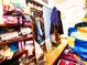 View of small bedroom with full closet and cluttered decor at 871 S Worchester St, Aurora, CO 80012