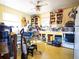 Functional kitchen with bright yellow cabinets, offering ample storage and workspace for cooking and meal preparation at 871 S Worchester St, Aurora, CO 80012