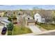 An elevated view of a two-story home with a green lawn in a suburban neighborhood at 5174 S Ukraine St, Aurora, CO 80015