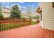 Spacious red stained back deck offers a serene outdoor living space at 5174 S Ukraine St, Aurora, CO 80015