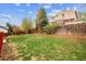 Large grass backyard featuring a wood fence for privacy at 5174 S Ukraine St, Aurora, CO 80015