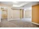 Large finished basement with neutral carpet and plenty of open space at 5174 S Ukraine St, Aurora, CO 80015