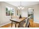 Inviting dining area with hardwood floors, a stylish table, and plenty of natural light at 5174 S Ukraine St, Aurora, CO 80015