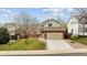 Charming two-story home featuring a well-maintained front yard and attached two-car garage at 5174 S Ukraine St, Aurora, CO 80015