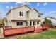 Exterior showcasing a two-story home with a back deck and well-maintained lawn at 5174 S Ukraine St, Aurora, CO 80015