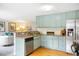 Bright kitchen with granite countertops, stainless appliances, eat in bar, and lots of room for storage at 5174 S Ukraine St, Aurora, CO 80015