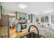 Well-lit kitchen features granite countertops, stainless appliances, ample storage, and a view to the backyard at 5174 S Ukraine St, Aurora, CO 80015
