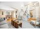 Bright living room featuring an open floor plan with natural light, and dining area at 5174 S Ukraine St, Aurora, CO 80015