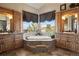 Elegant bathroom with soaking tub and dual vanities at 4479 Tierra Alta Dr, Castle Rock, CO 80104