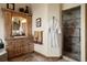 Spa-like bathroom with custom cabinetry and walk-in shower at 4479 Tierra Alta Dr, Castle Rock, CO 80104