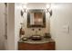 Powder room with granite countertop and ornate mirror at 4479 Tierra Alta Dr, Castle Rock, CO 80104