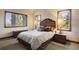 Comfortable bedroom with mountain views and wood accents at 4479 Tierra Alta Dr, Castle Rock, CO 80104