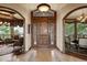 Elegant entryway with hardwood floors and views to the living and dining areas at 4479 Tierra Alta Dr, Castle Rock, CO 80104