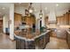 Spacious kitchen boasts a large island and custom cabinetry at 4479 Tierra Alta Dr, Castle Rock, CO 80104