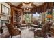 Cozy library with built-in bookshelves and fireplace at 4479 Tierra Alta Dr, Castle Rock, CO 80104