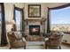 Cozy living room with fireplace and mountain views at 4479 Tierra Alta Dr, Castle Rock, CO 80104