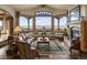 Spacious living room with hardwood floors, fireplace, and large windows at 4479 Tierra Alta Dr, Castle Rock, CO 80104