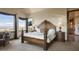 Luxurious main bedroom with stunning views and fireplace at 4479 Tierra Alta Dr, Castle Rock, CO 80104