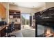 Home office with fireplace, built-ins, and scenic views at 4479 Tierra Alta Dr, Castle Rock, CO 80104