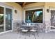 Small patio with table and chairs, near sliding doors at 4479 Tierra Alta Dr, Castle Rock, CO 80104