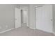 Carpeted bedroom with a closet and neutral walls at 1775 Aspen Meadows Cir, Denver, CO 80260