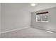 Carpeted bedroom with a window and neutral gray walls at 1775 Aspen Meadows Cir, Denver, CO 80260