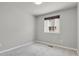 Carpeted bedroom with a window and neutral gray walls at 1775 Aspen Meadows Cir, Denver, CO 80260