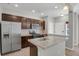 Modern kitchen with stainless steel appliances, granite countertops, and ample cabinet space at 1775 Aspen Meadows Cir, Denver, CO 80260