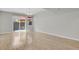 Bright living area with hardwood floors and sliding glass doors leading to an outdoor space at 1775 Aspen Meadows Cir, Denver, CO 80260